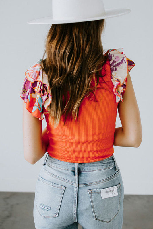Orange ribbed knit bodysuit with ruffled sleeves