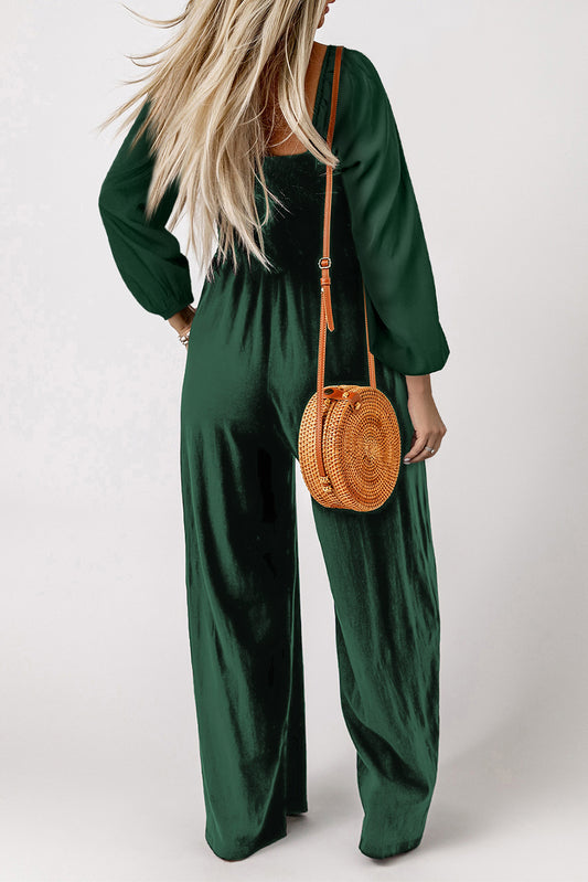 Long sleeve, wide leg jumpsuit with square neck and green ruffle